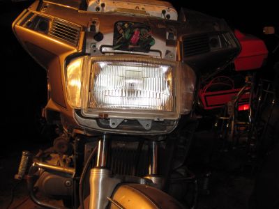 Headlight brackets removed.  The headlight is free to move now, but the wiring is holding it back.
Keywords: 1984;goldwing;gl1200