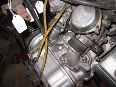 Unbolting the intake pipes from the head.
Keywords: gl1200;goldwing;1984